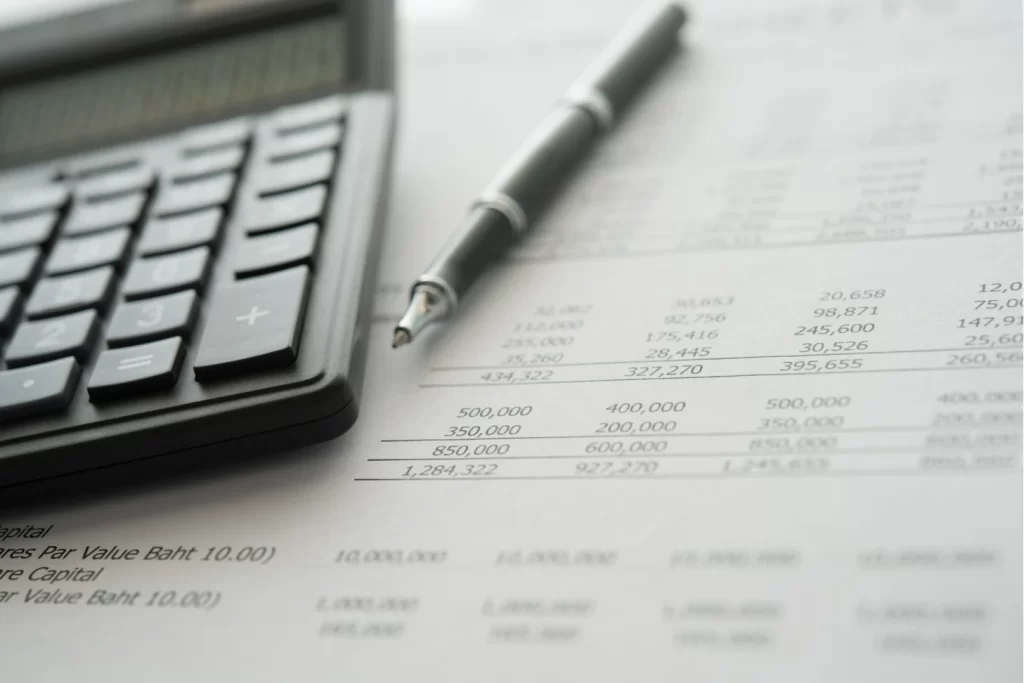 Accounting financial business concept closeup calculator on financial statement.